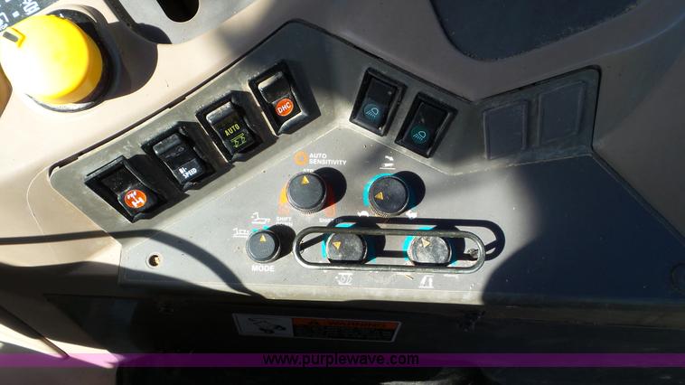 image for item G7104 Kubota M125X MFWD tractor