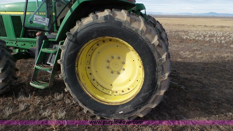 image for item K8306 2002 John Deere 7510 tractor