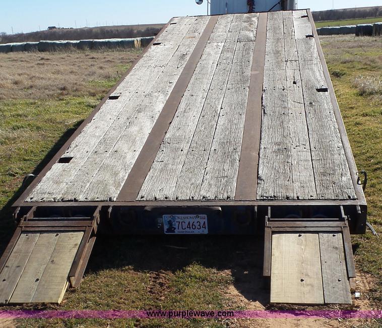 image for item J1304 1983 Wisconsin 2500-22 tilt deck trailer