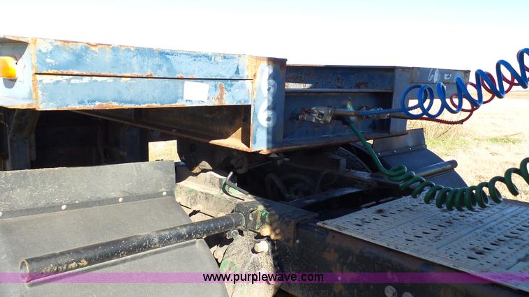 image for item J1304 1983 Wisconsin 2500-22 tilt deck trailer