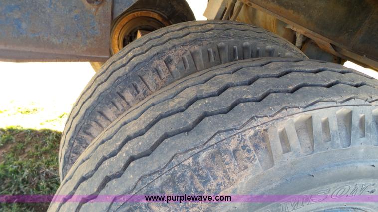 image for item J1304 1983 Wisconsin 2500-22 tilt deck trailer