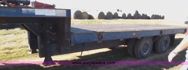 image for item J1304 1983 Wisconsin 2500-22 tilt deck trailer