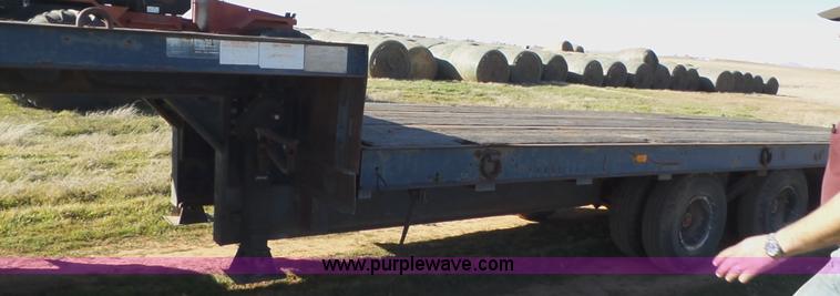 image for item J1304 1983 Wisconsin 2500-22 tilt deck trailer