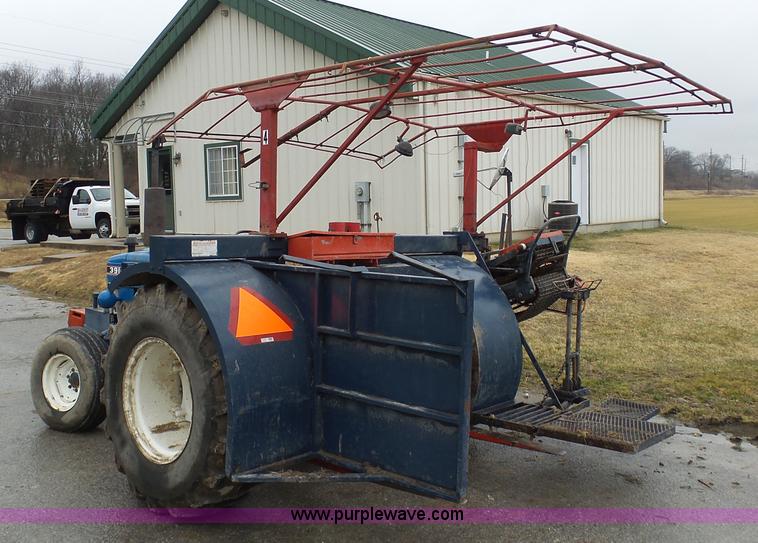 image for item K7664 Ford 3910 tractor with Brouwer sod harvester