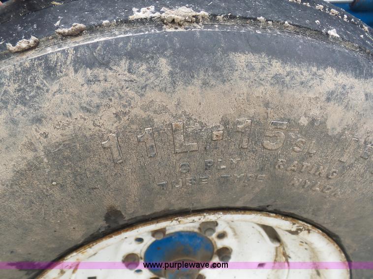 image for item K7664 Ford 3910 tractor with Brouwer sod harvester