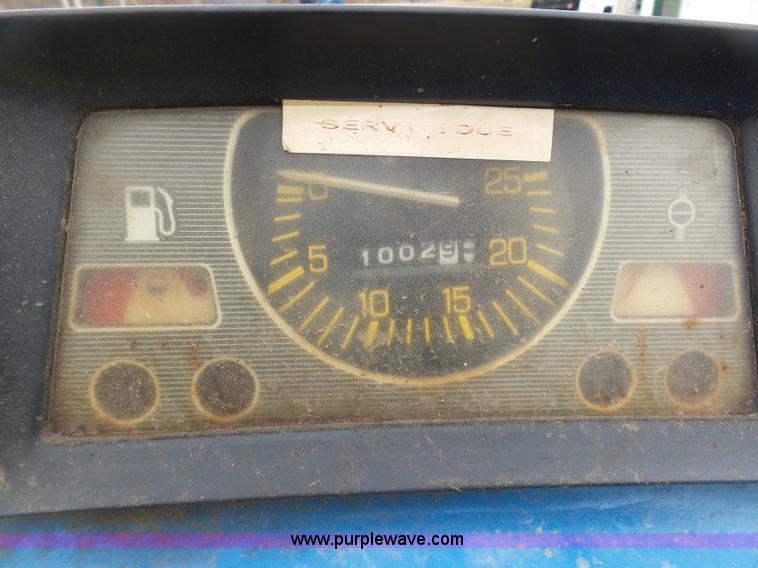 image for item K7664 Ford 3910 tractor with Brouwer sod harvester