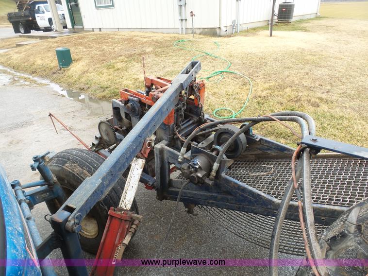 image for item K7664 Ford 3910 tractor with Brouwer sod harvester