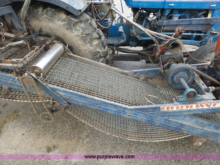 image for item K7664 Ford 3910 tractor with Brouwer sod harvester