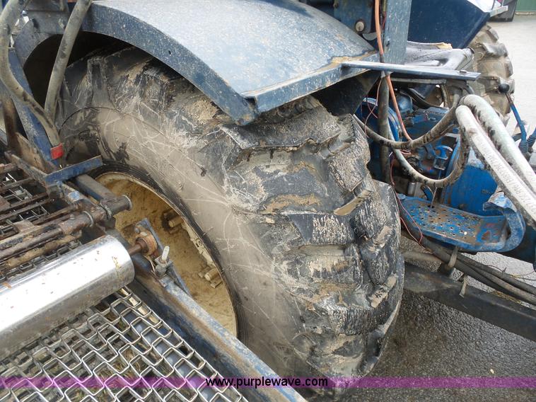 image for item K7664 Ford 3910 tractor with Brouwer sod harvester