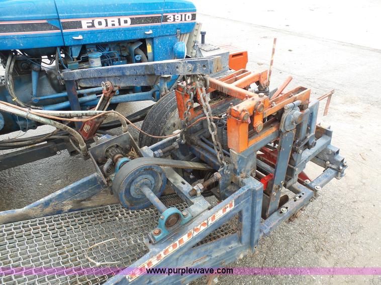 image for item K7664 Ford 3910 tractor with Brouwer sod harvester