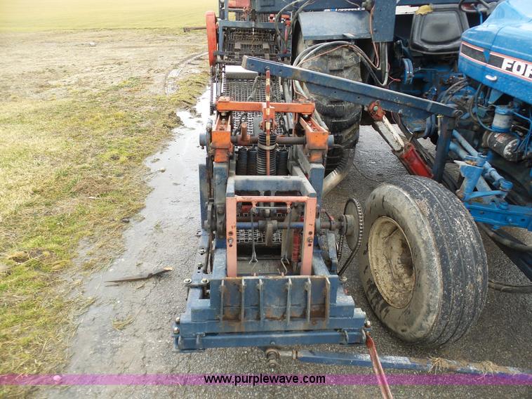 image for item K7664 Ford 3910 tractor with Brouwer sod harvester