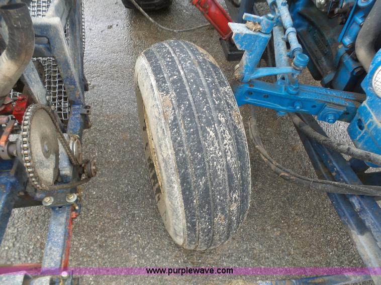 image for item K7664 Ford 3910 tractor with Brouwer sod harvester