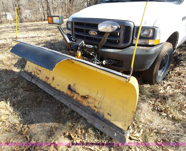 image for item K7609 2003 Ford F250 Super Duty SuperCab flatbed pickup truck