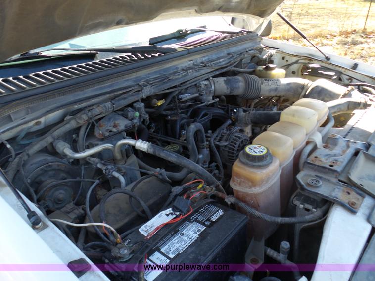 image for item K7609 2003 Ford F250 Super Duty SuperCab flatbed pickup truck