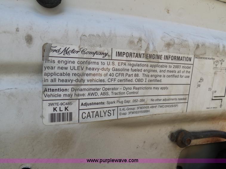 image for item K7609 2003 Ford F250 Super Duty SuperCab flatbed pickup truck