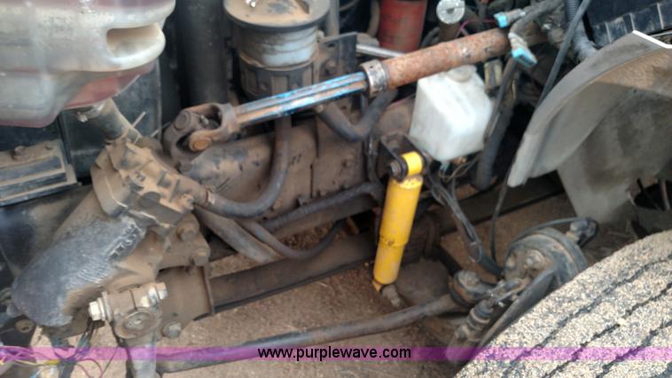 image for item L6112 2004 International DuraStar 4300 rollback truck