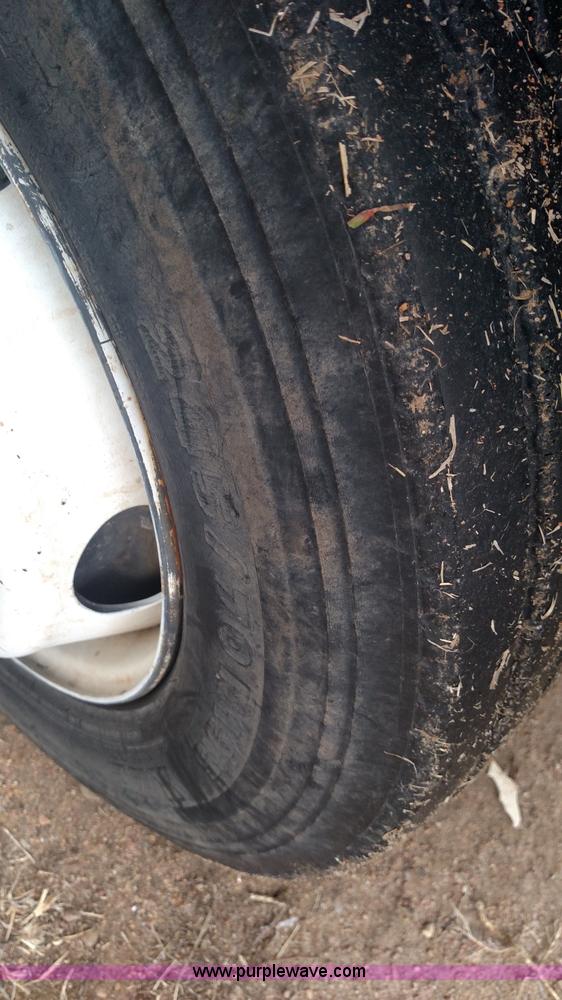 image for item L6112 2004 International DuraStar 4300 rollback truck