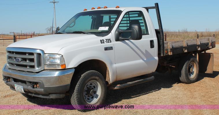 image for item L6786 2002 Ford F350 Super Duty XLT flatbed pickup truck