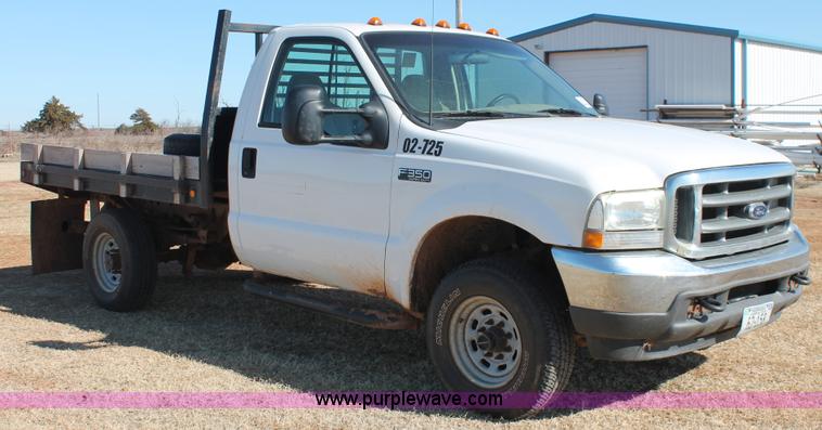 image for item L6786 2002 Ford F350 Super Duty XLT flatbed pickup truck