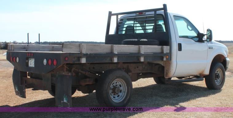 image for item L6786 2002 Ford F350 Super Duty XLT flatbed pickup truck