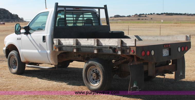 image for item L6786 2002 Ford F350 Super Duty XLT flatbed pickup truck