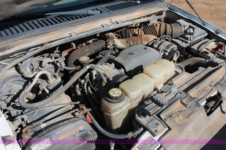 image for item L6786 2002 Ford F350 Super Duty XLT flatbed pickup truck