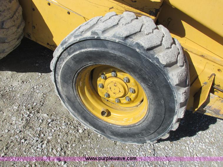 image for item L7098 1997 John Deere 8875 skid steer