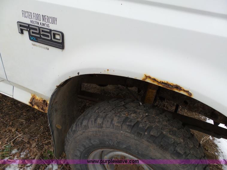 image for item J7373 1994 Ford F250 XL HD flatbed pickup truck