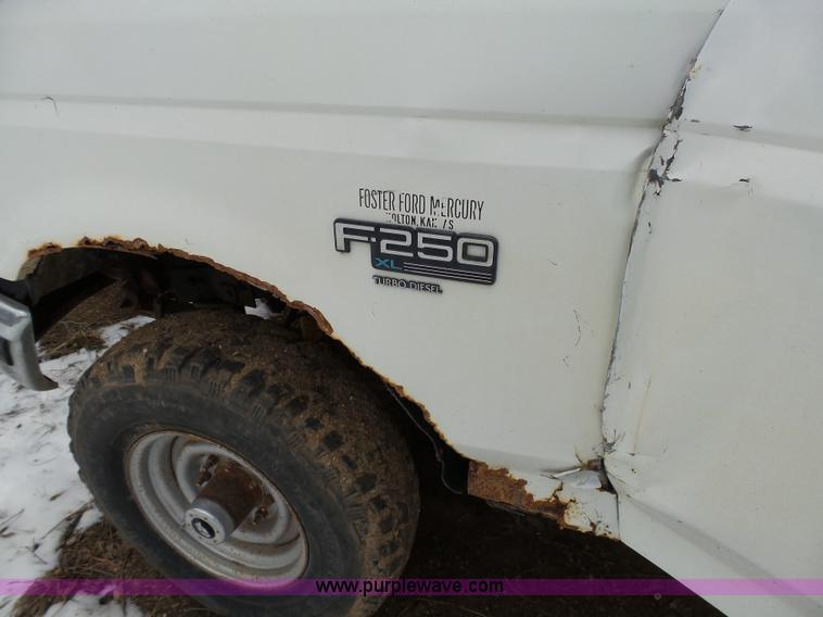 image for item J7373 1994 Ford F250 XL HD flatbed pickup truck