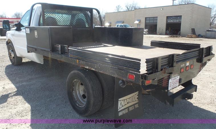 image for item J4710 2007 Ford F350 Super Duty flatbed pickup truck
