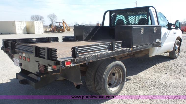 image for item J4710 2007 Ford F350 Super Duty flatbed pickup truck