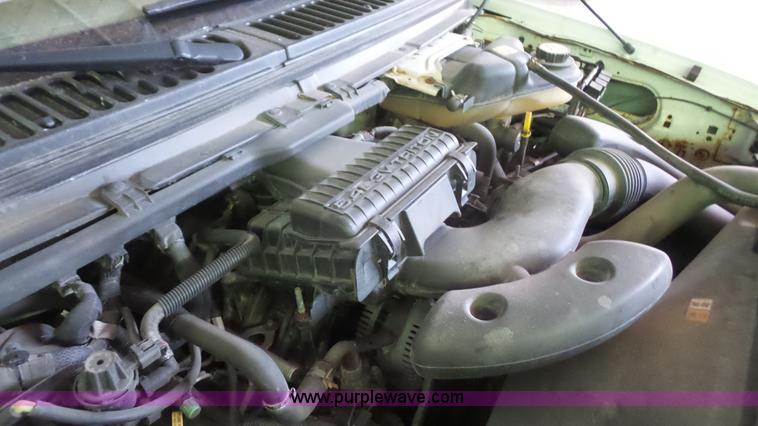 image for item J4737 2006 Ford F350 Super Duty flatbed pickup truck