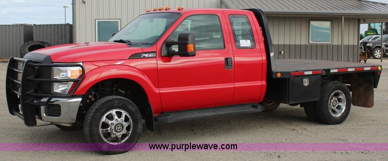 image for item J7577 2012 Ford F350 Super Duty XLT SuperCab flatbed pickup truck