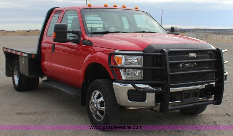 image for item J7577 2012 Ford F350 Super Duty XLT SuperCab flatbed pickup truck