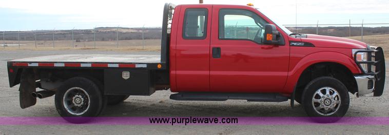image for item J7577 2012 Ford F350 Super Duty XLT SuperCab flatbed pickup truck