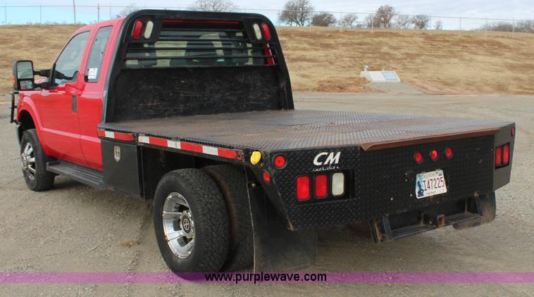 image for item J7577 2012 Ford F350 Super Duty XLT SuperCab flatbed pickup truck