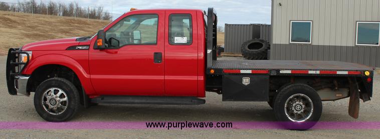 image for item J7577 2012 Ford F350 Super Duty XLT SuperCab flatbed pickup truck