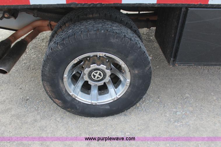 image for item J7577 2012 Ford F350 Super Duty XLT SuperCab flatbed pickup truck