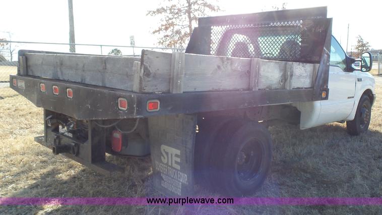 image for item L3674 2000 Ford F350 Super Duty XL flatbed pickup truck