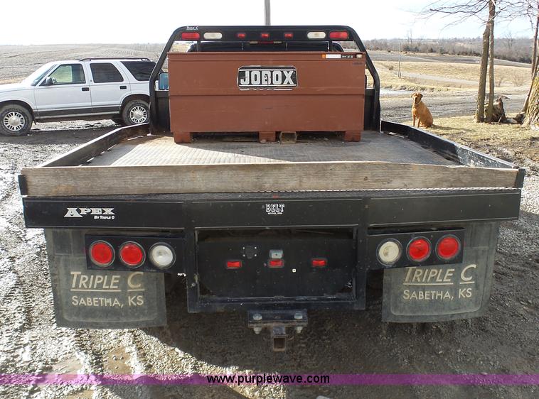 image for item L7069 1995 Chevrolet 3500 Ext. Cab flatbed pickup truck