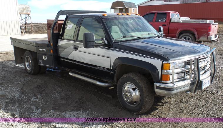 image for item L7069 1995 Chevrolet 3500 Ext. Cab flatbed pickup truck