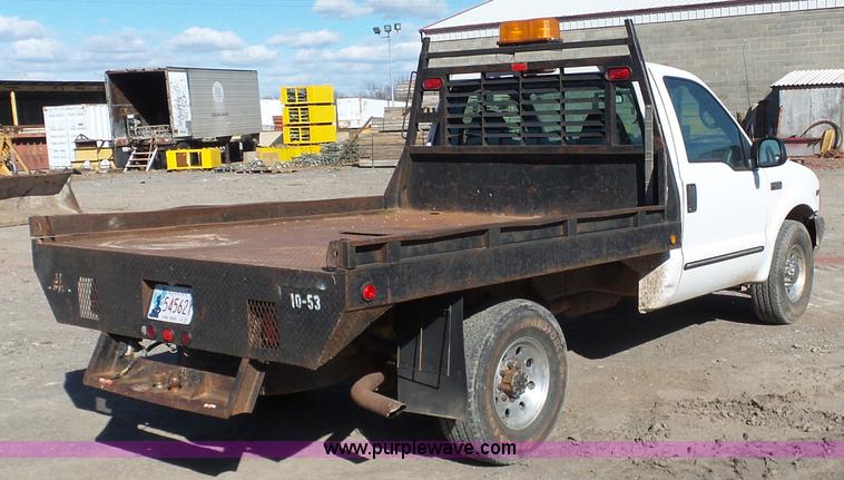 image for item J7599 2000 Ford F250 Super Duty flatbed pickup truck