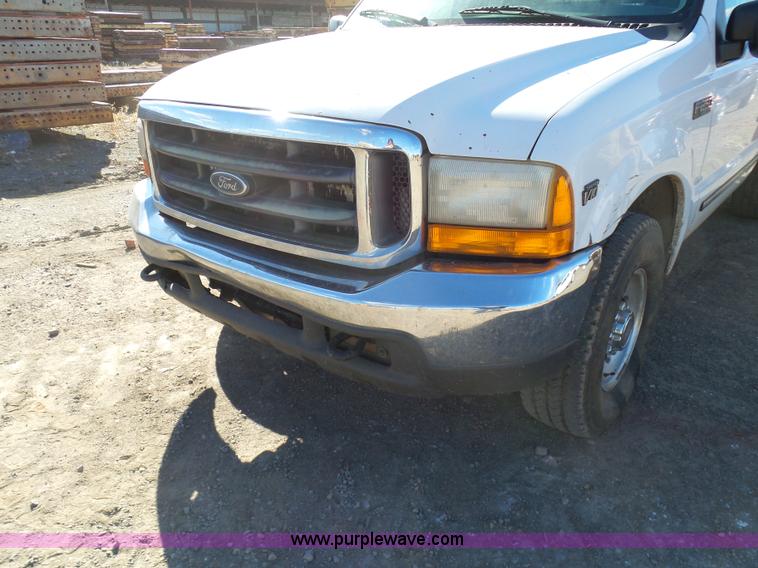 image for item J7599 2000 Ford F250 Super Duty flatbed pickup truck