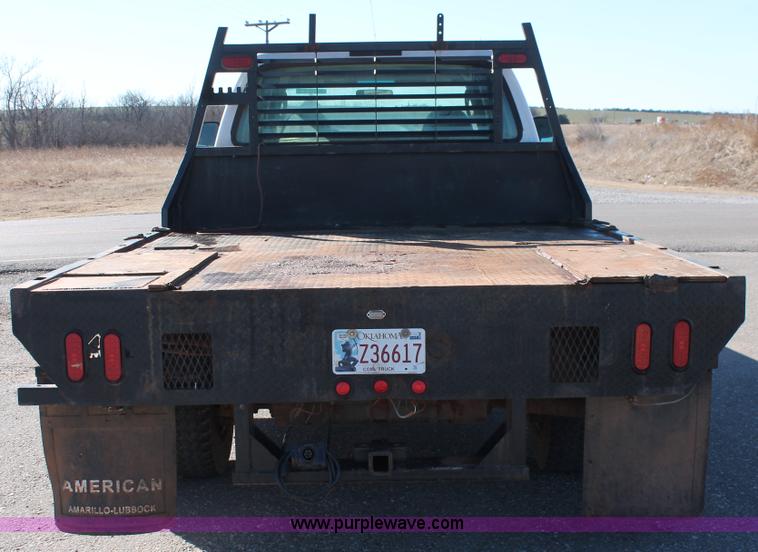image for item L6799 2006 Ford F450 Super Duty Crew Cab flatbed truck