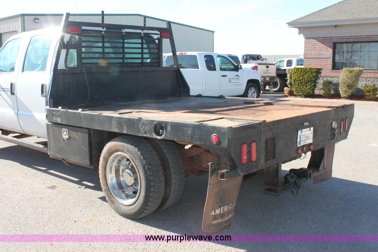 image for item L6799 2006 Ford F450 Super Duty Crew Cab flatbed truck