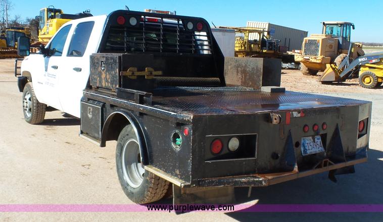 image for item L6812 2011 Chevrolet Silverado 3500HD Crew Cab flatbed pickup truck