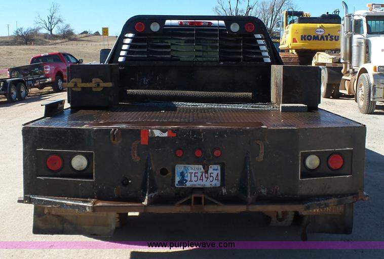 image for item L6812 2011 Chevrolet Silverado 3500HD Crew Cab flatbed pickup truck