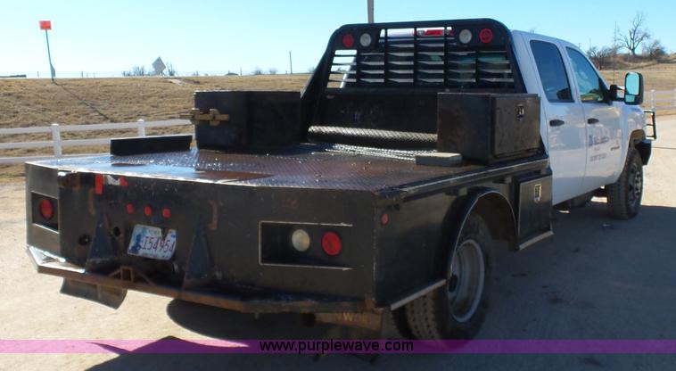 image for item L6812 2011 Chevrolet Silverado 3500HD Crew Cab flatbed pickup truck