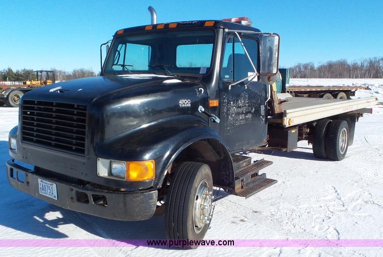image for item K4507 1997 International 4700 rollback truck