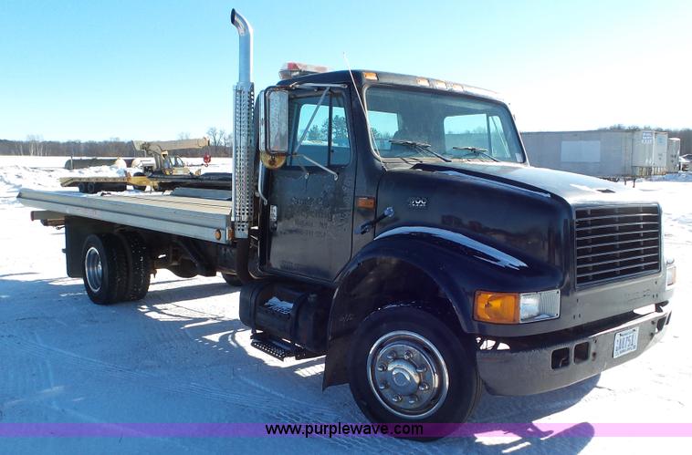 image for item K4507 1997 International 4700 rollback truck